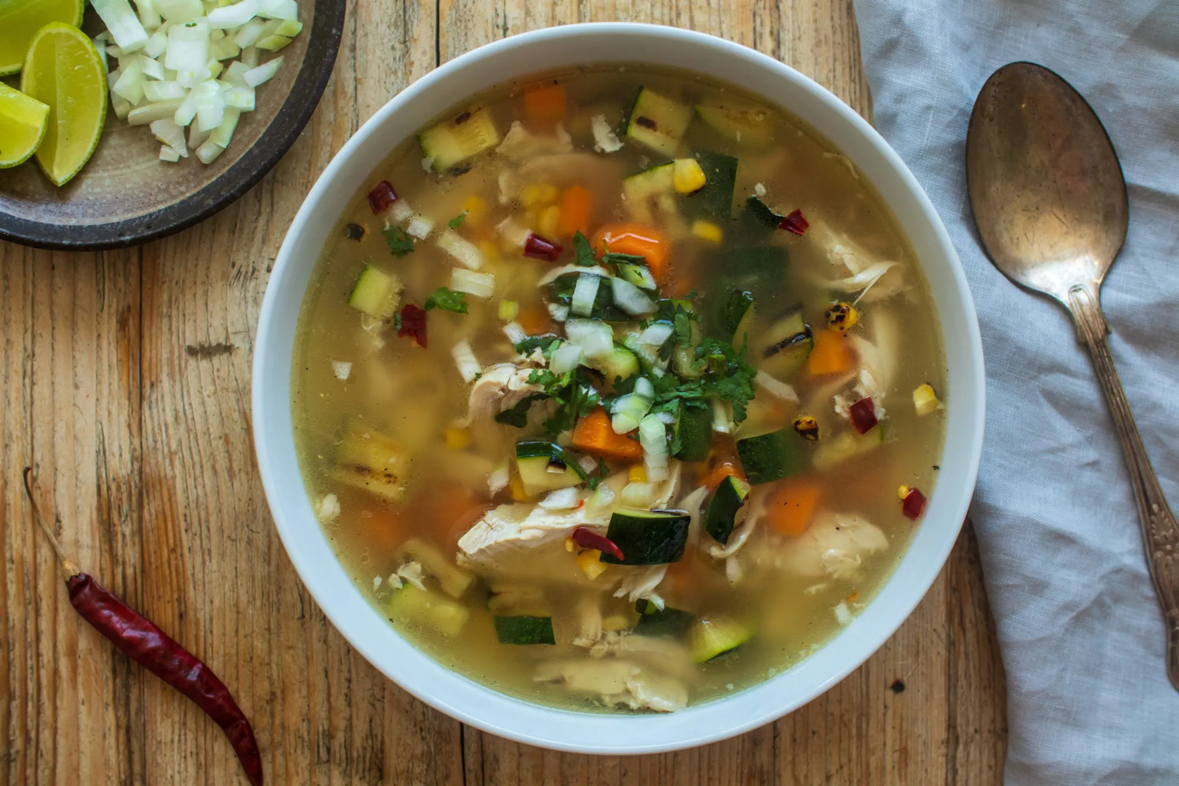 Chicken soup with charred corn and courgette